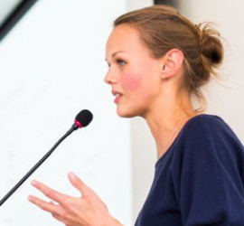 woman speaking on microphone